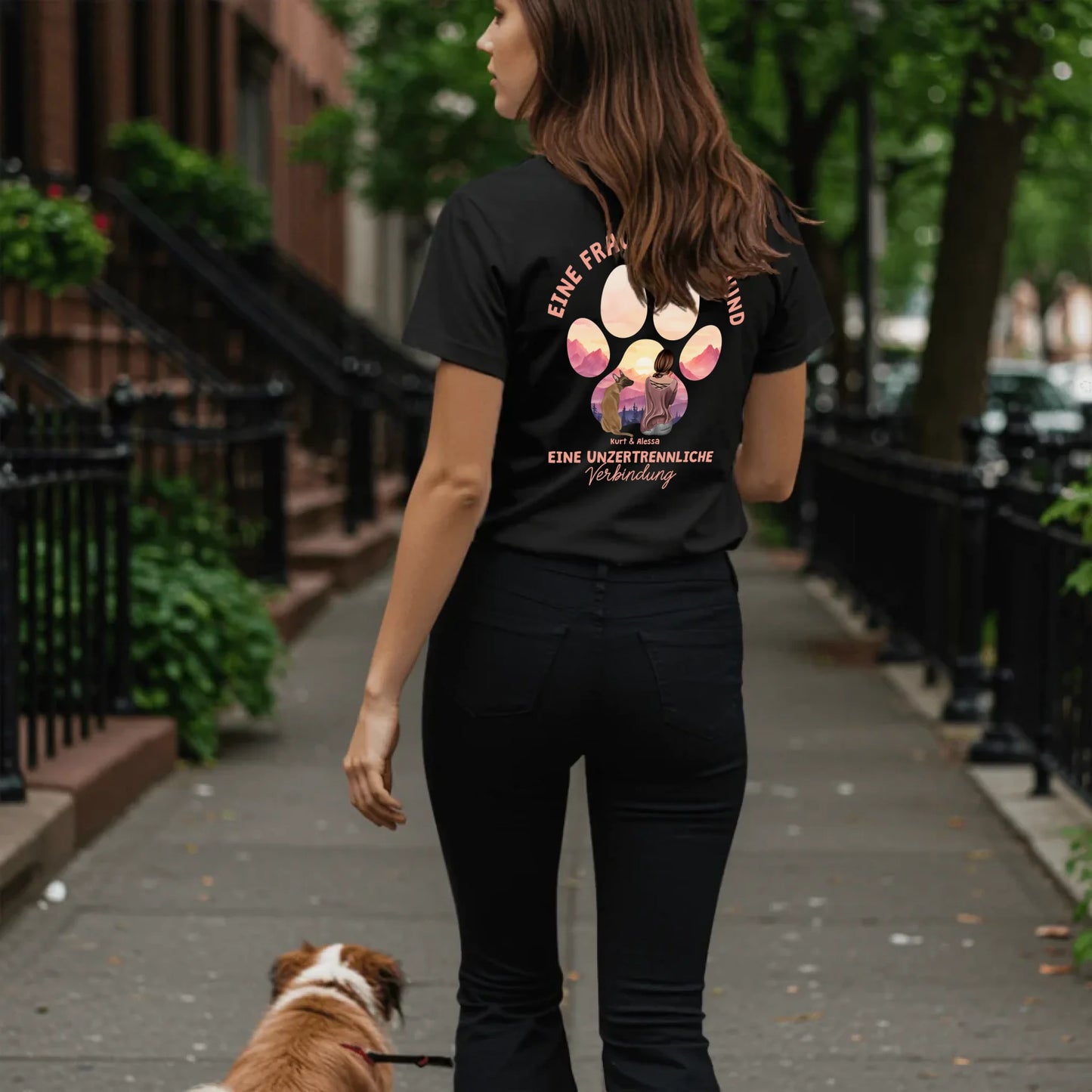 Woman walking dog on sidewalk - Black