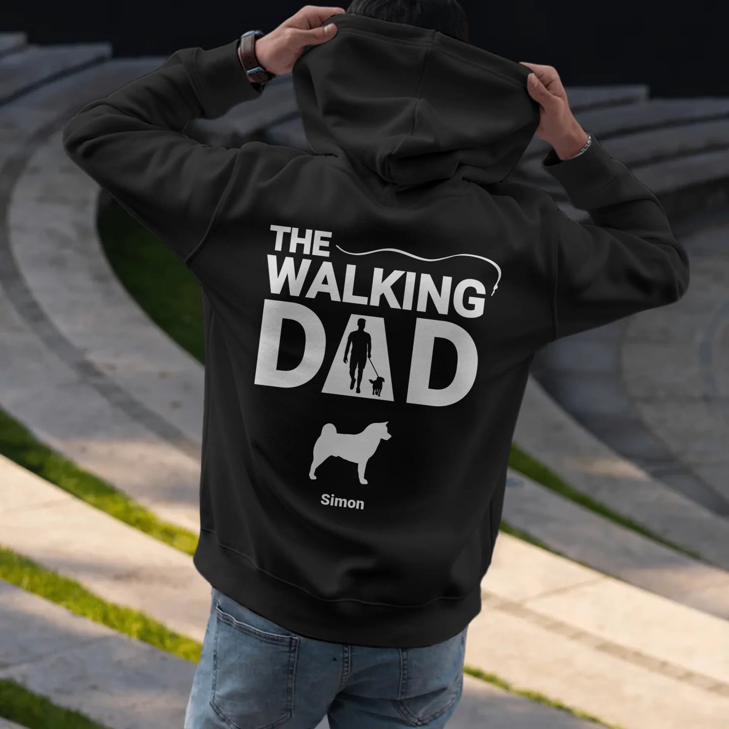 Man putting on hoodie - Black