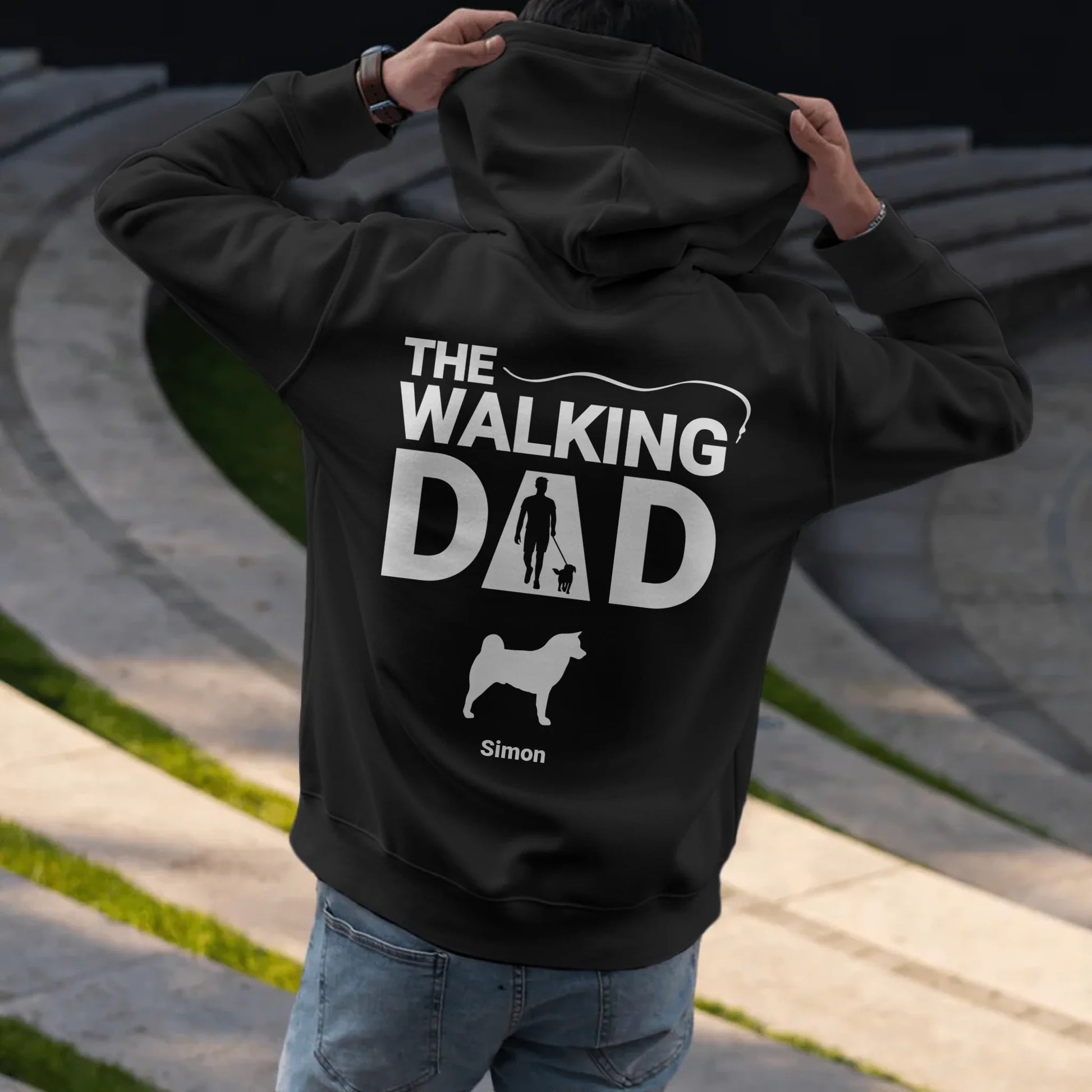 Man putting on hoodie - Black