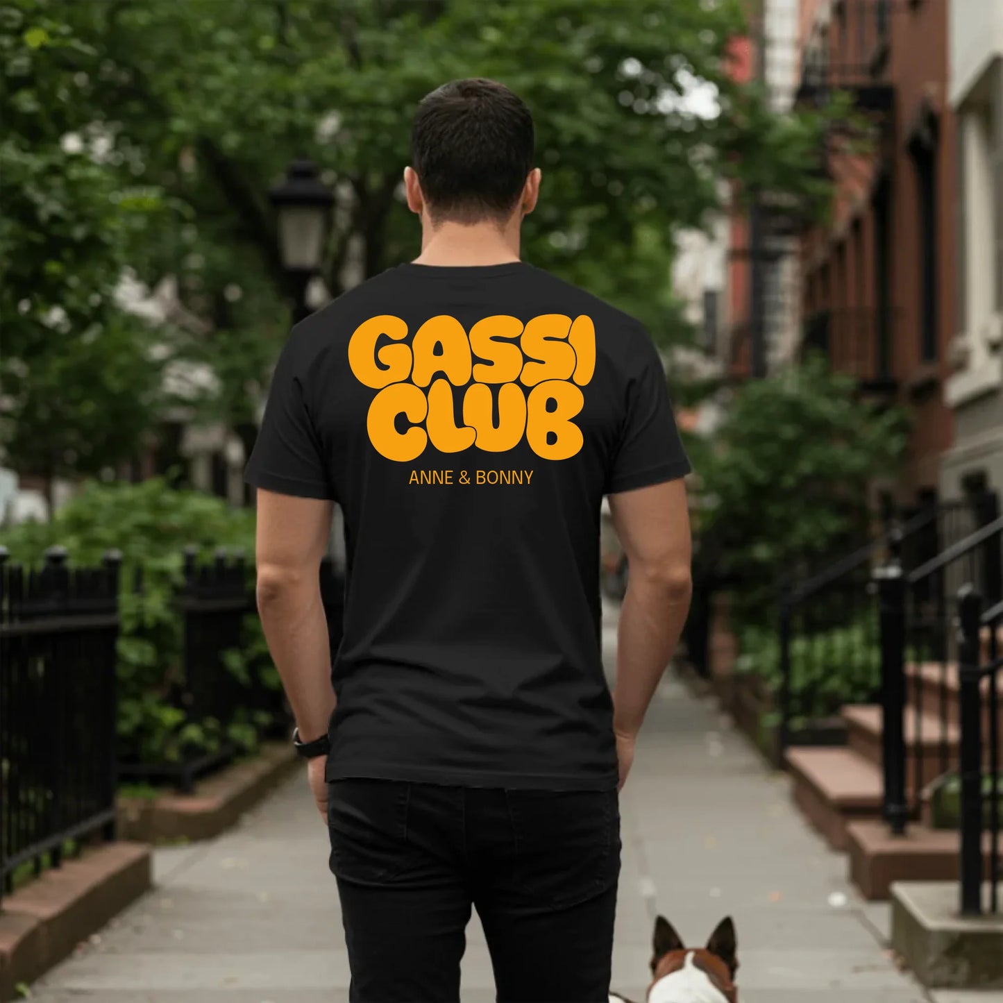 Man walking dog on sidewalk - Black