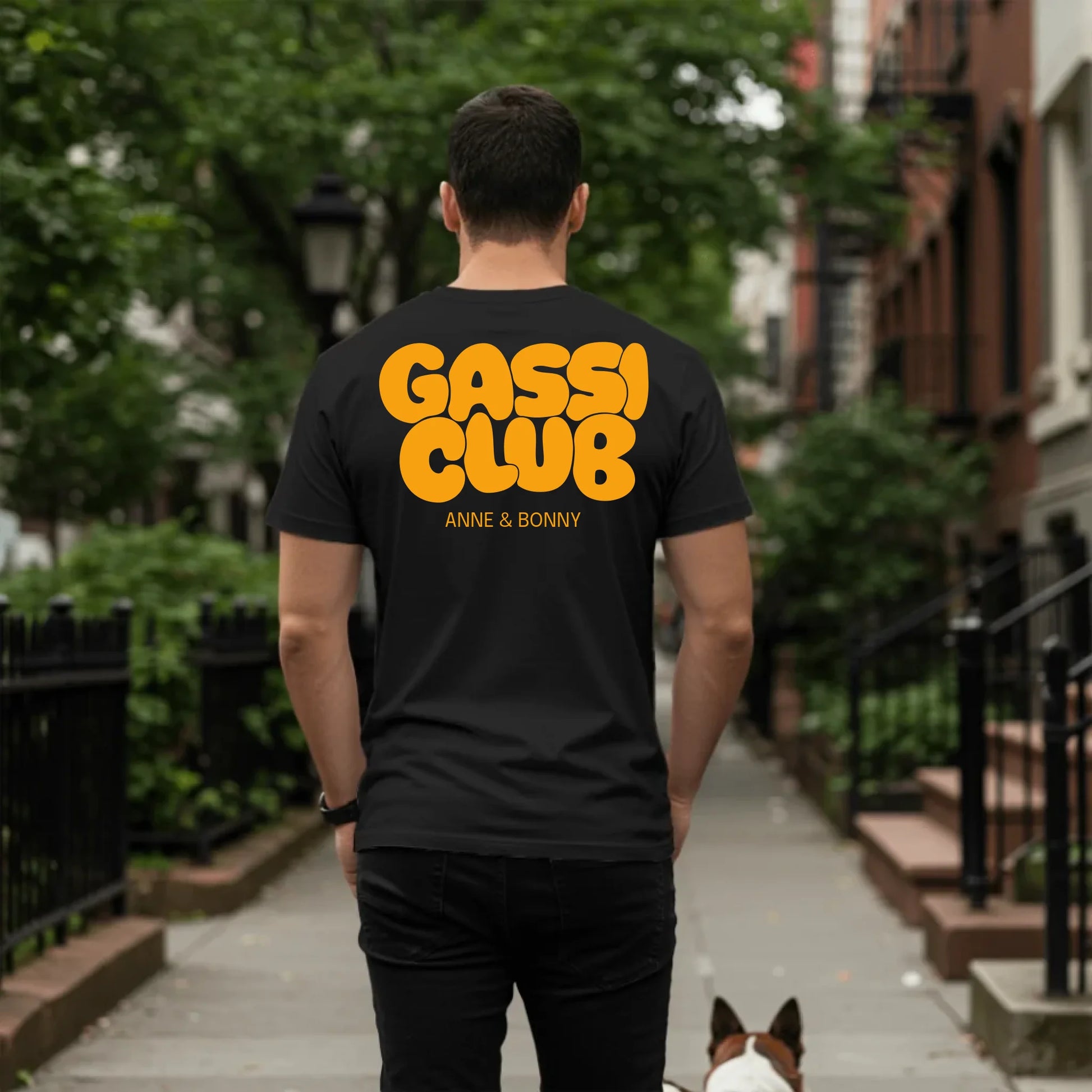 Man walking dog on sidewalk - Black